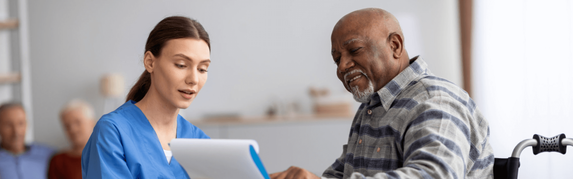 elderly man answering the referral form